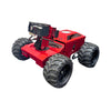Red off-road vehicle with large black tires on a white background
