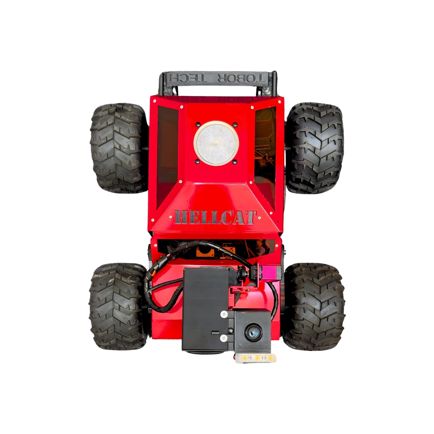 Red monster truck model with large black tires on a white background
